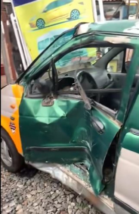 Alajo: Driver narrowly escapes Death as Taxi collides with Train
