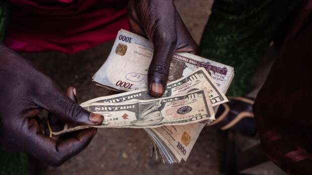 Nigeria orders banks to cut forex exposures as naira plunges