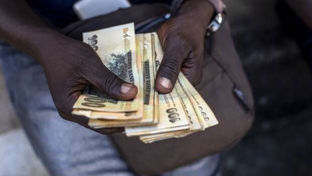 Battered Zimbabwe currency falls past 20,000 per dollar in official trade